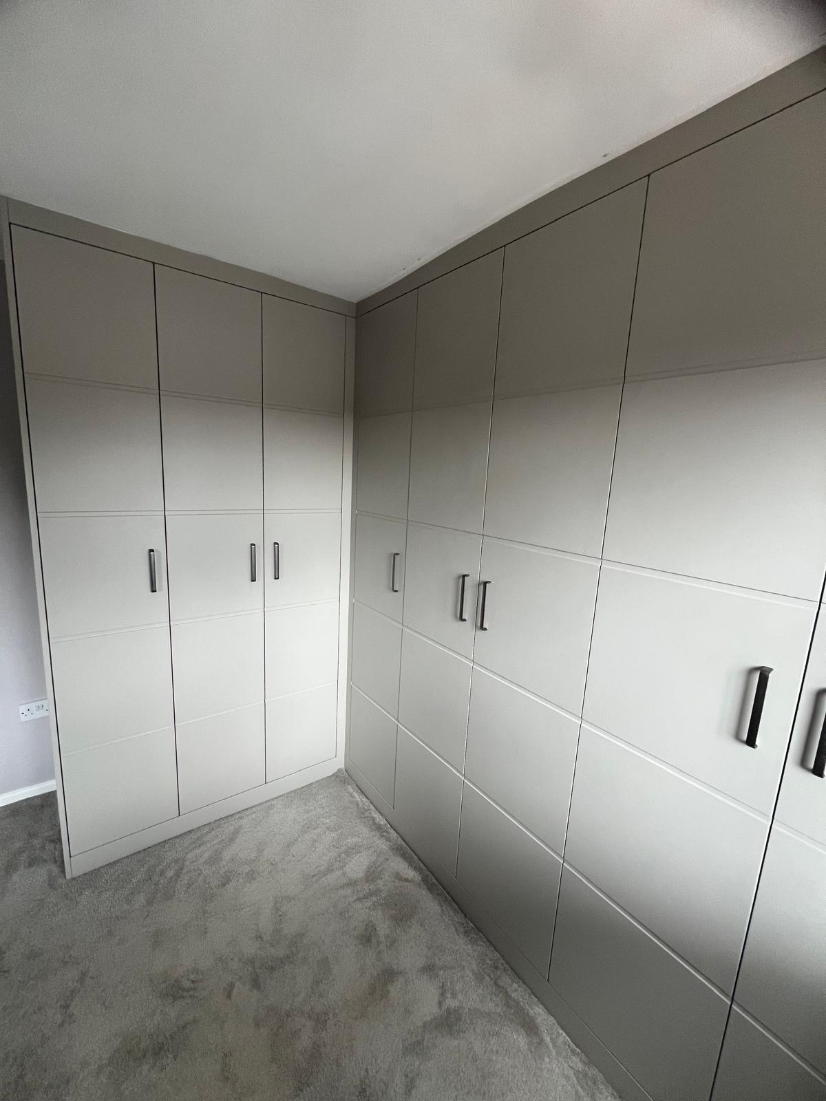 Bespoke walk-in wardrobe with hanging rails and drawer units