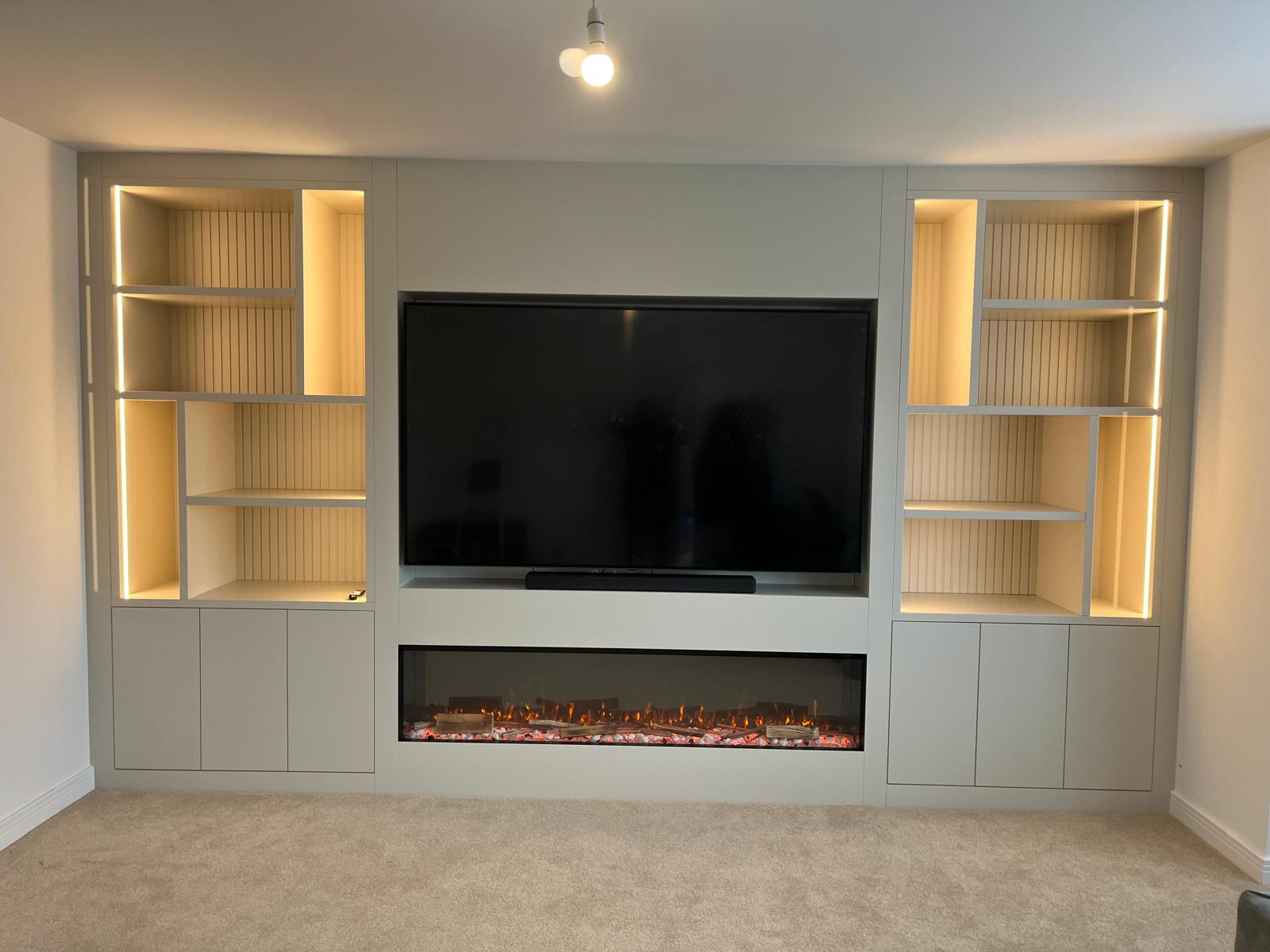 Bespoke TV media wall with integrated fireplace and storage